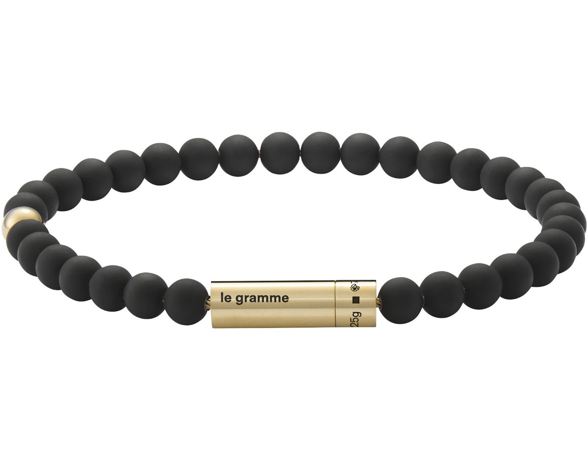 soft black bead bracelet with 1 yellow gold bead 29g